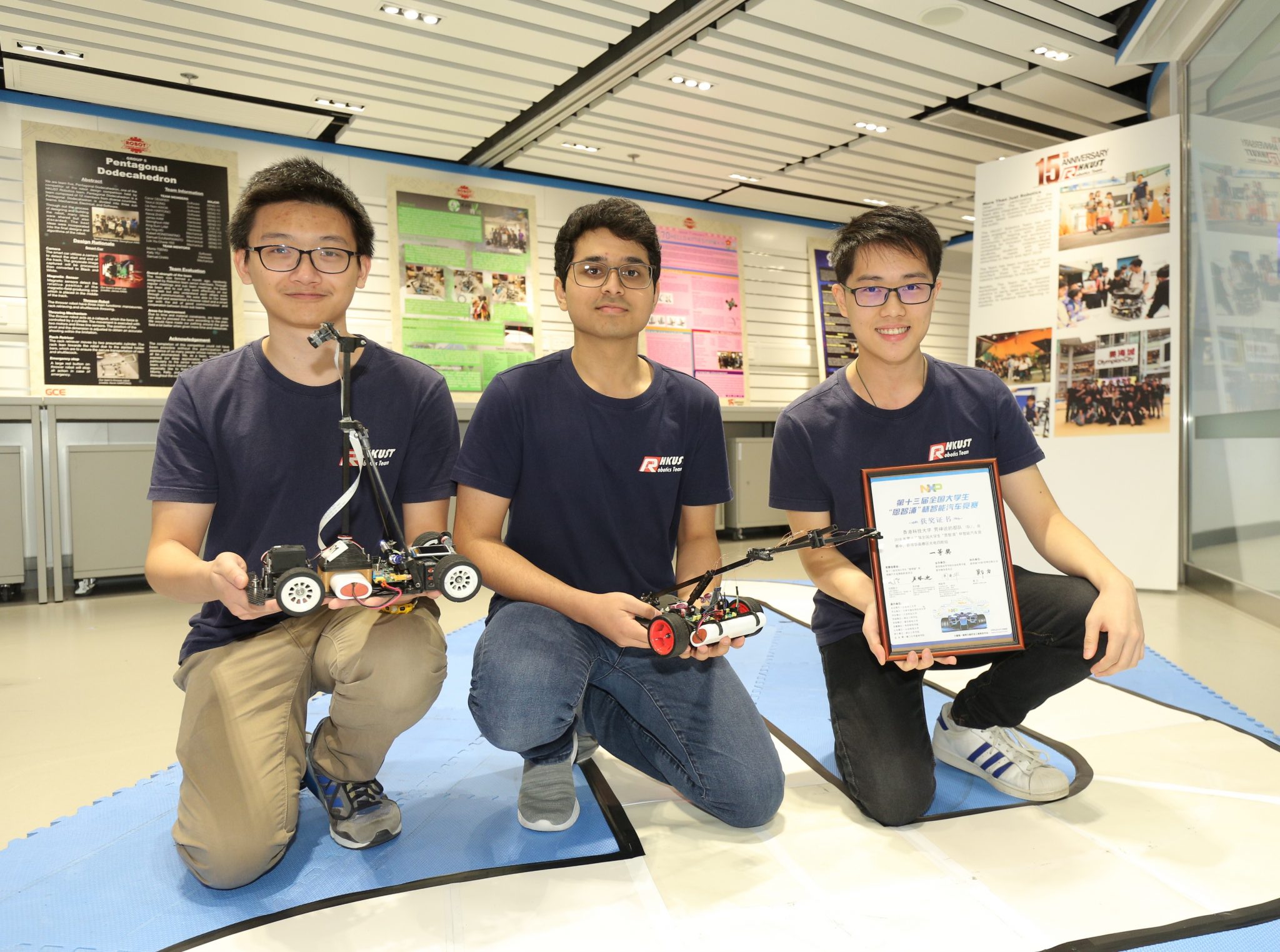 (From left) Daniel Cheung, Amrutavarsh Sanganabasappa Kinagi and Leslie Lee Chun-Hei, who won First Class Award in the 13th NXP Cup Intelligent Car Racing Competition (South China Region) held in Hubei province in July 2018, demonstrate their smart car in the Dream Team Open Lab