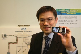 Live TV contents are being fed into the mobile phone via a computer through streaming technology.	