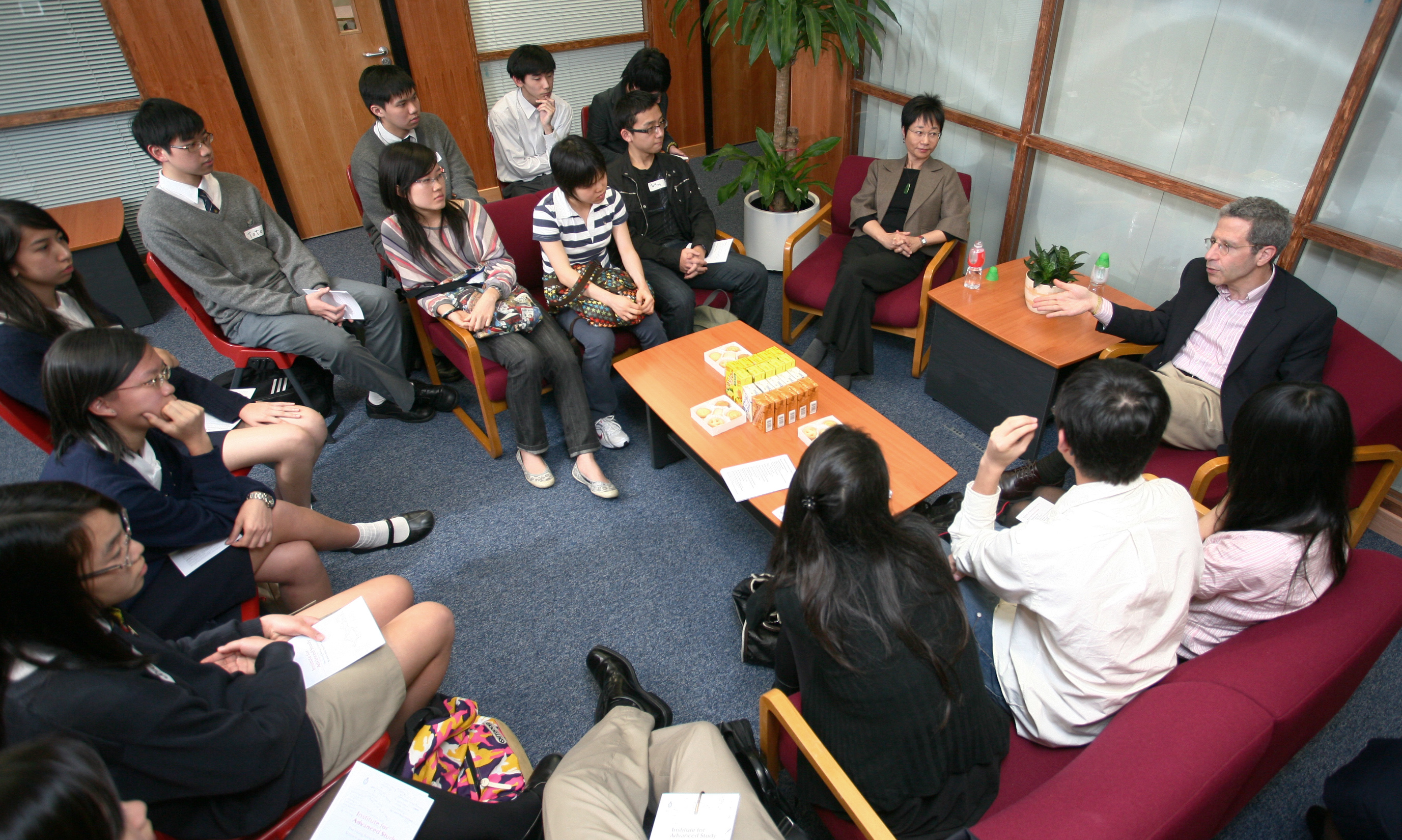 Prof Maskin (extreme right) exchanging views with students	