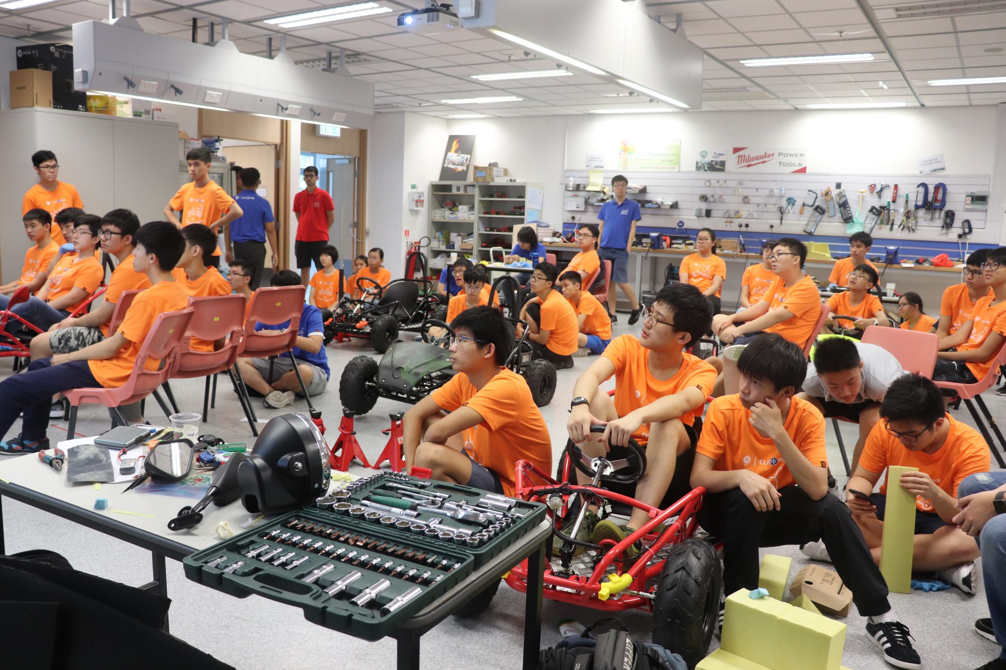  Students attend class on how to add the final touches to their vehicle.