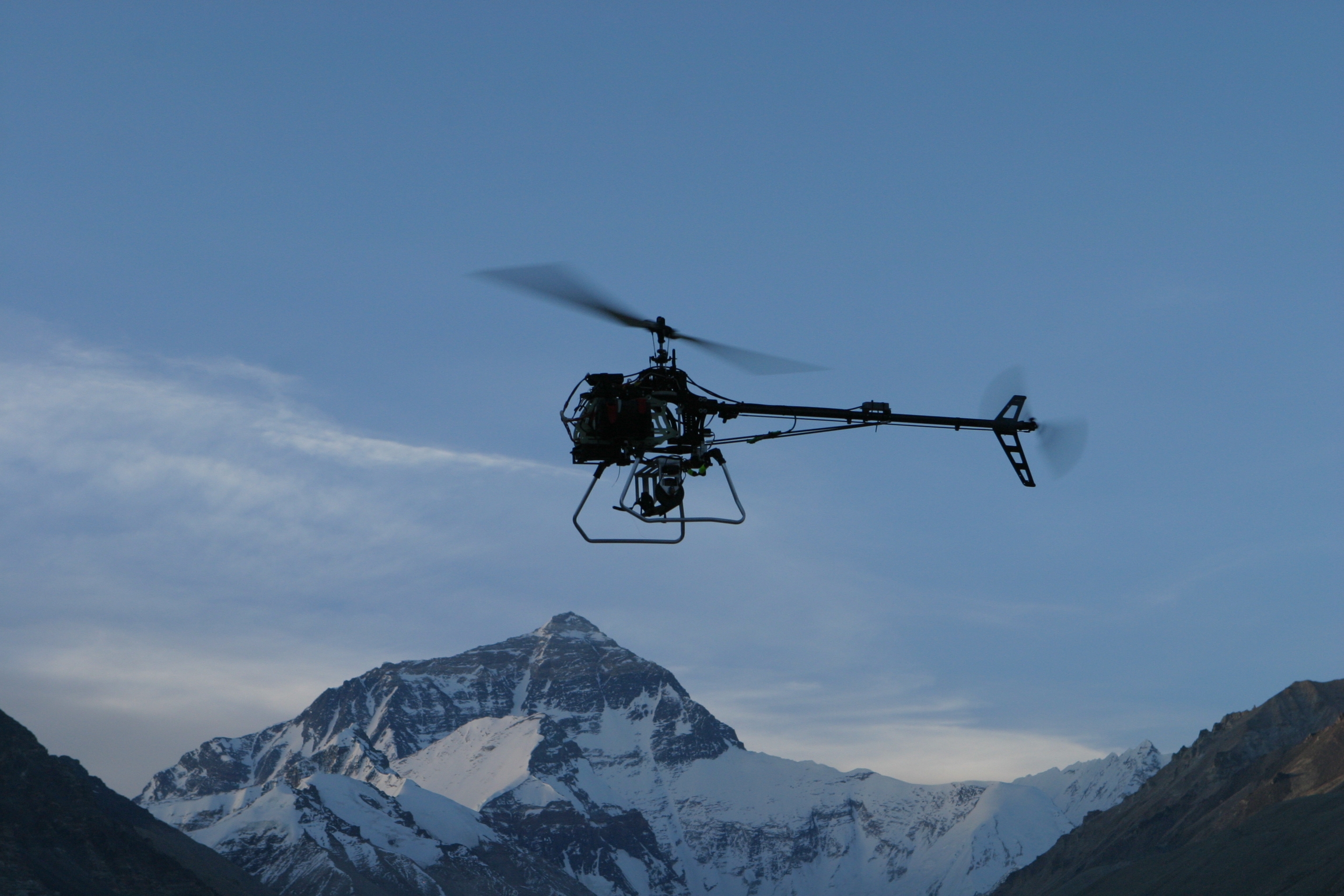 The helicopter flying towards Mount Everest