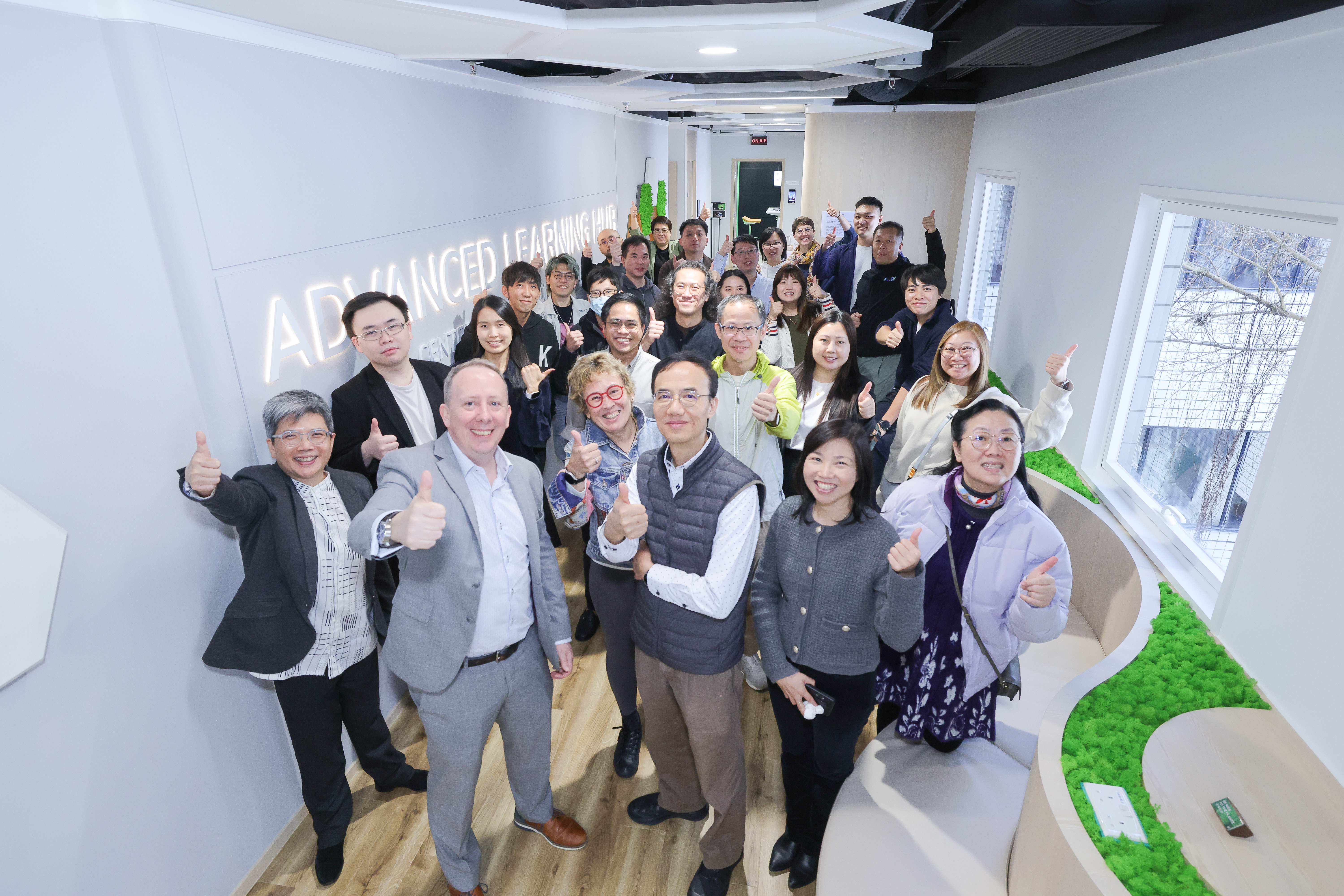 Dr. Sean McMinn (front row, second from left), CEI Director; Dr. Alfreda Stadlin, (front row, third from left), Academic Affairs Director (Strategic Initiatives), Office of the Dean of Science; and Prof. Jimmy Fung (front row, fourth from left), Associate Provost (Teaching & Learning), with CEI staff at the ALH Open House in February.
